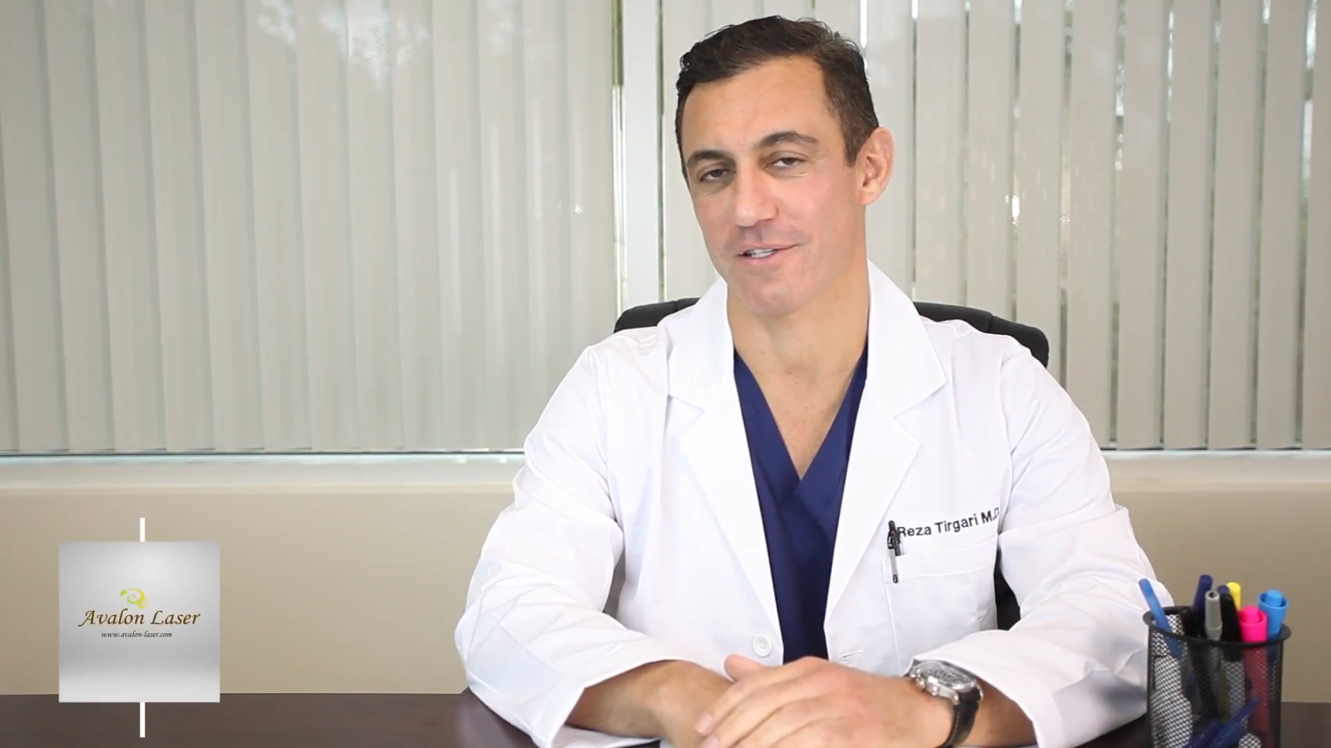 Dr. Tirgari talking at his desk.