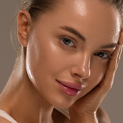 a woman with her hand on her face