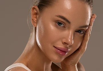 a woman with her hand on her face